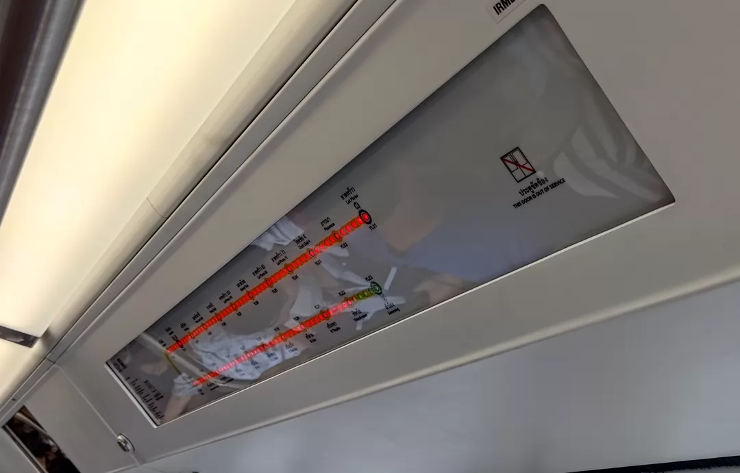 Side doors show route and station info.