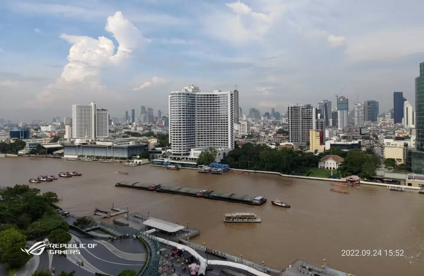 The view from the outdoor seating area overlooking the city and Chao Phraya River